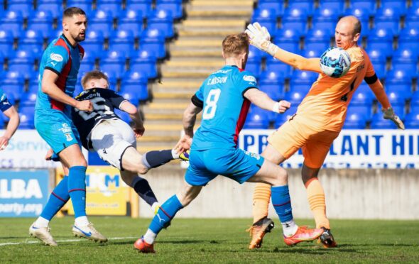 Lyall Cameron puts Dundee in front at Inverness with an improvised back heel. Image: SNS.