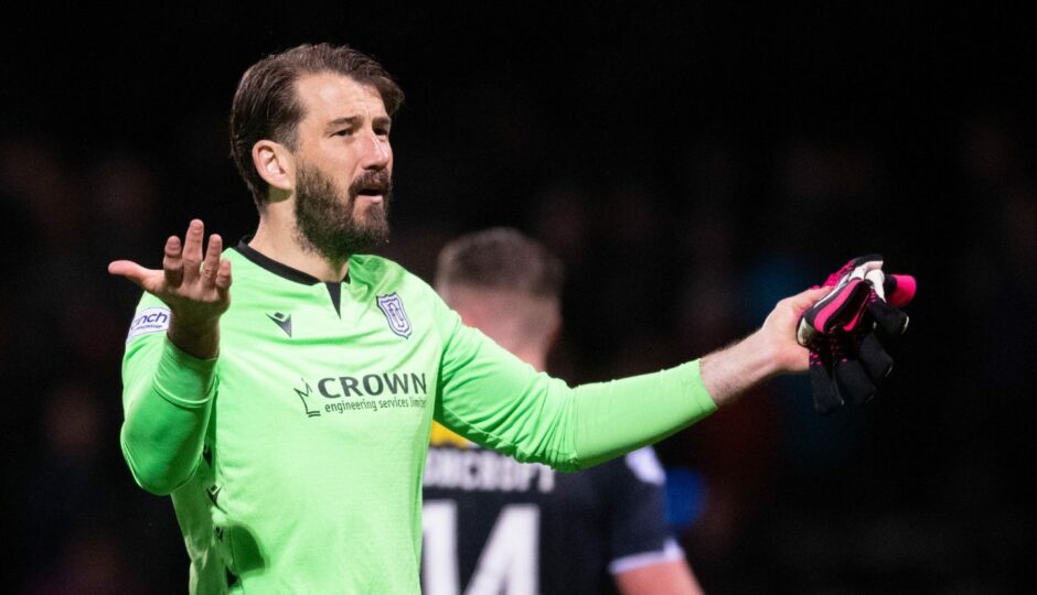 DUNDEE, SCOTLAND - APRIL 28: Dundee's Adam Legzdins at full time during a cinch Championship match between Dundee and Cove Rangers at the Kilmac Stadium at Dens Park, on April 28, 2023, in Dundee, Scotland. (Photo by Mark Scates / SNS Group)