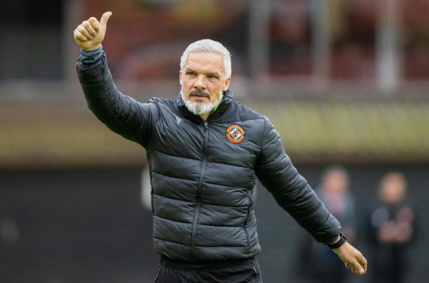 Jim Goodwin gives thumbs up to Dundee United supporters.