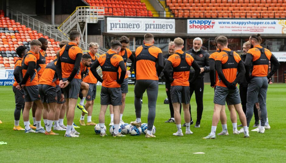 Jim Goodwin addresses Dundee United players during open training session.