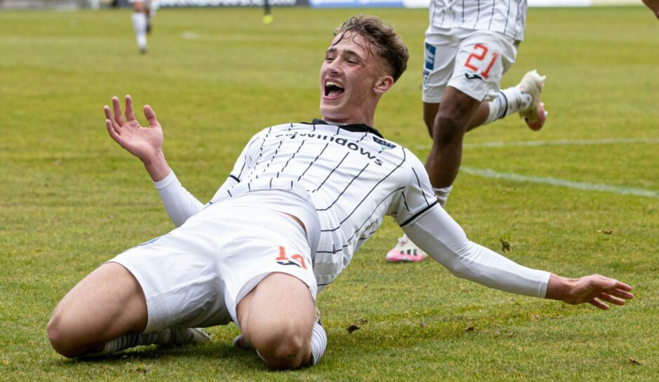 Lewis McCann slides on his knees as he celebrates scoring for Dunfermline Athletic.