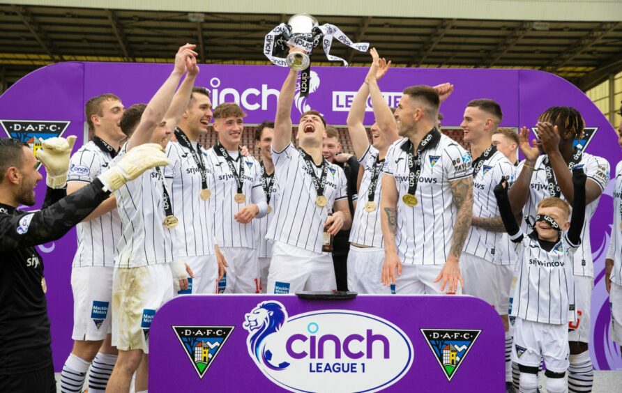 Dunfermline Athletic are presented with the League One trophy in 2023.