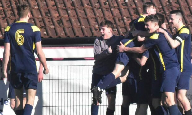 Celebrations after the third goal in the 3-1 semi-final win over Dunfermline High School.