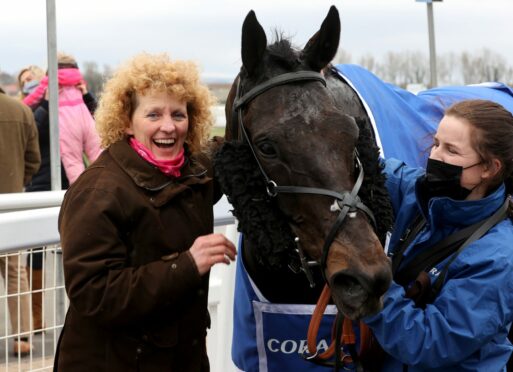 Lucinda Russell (left) celebrates in the parade ring with Mighty Thunder after the 2021 Scottish Grand National.