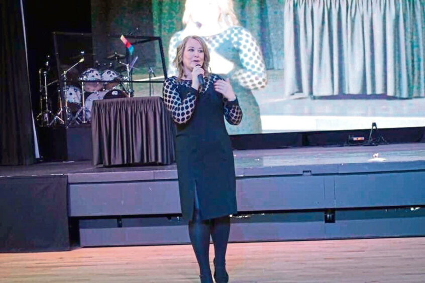 Carnoustie psychic medium Karen on the stage during a demo.