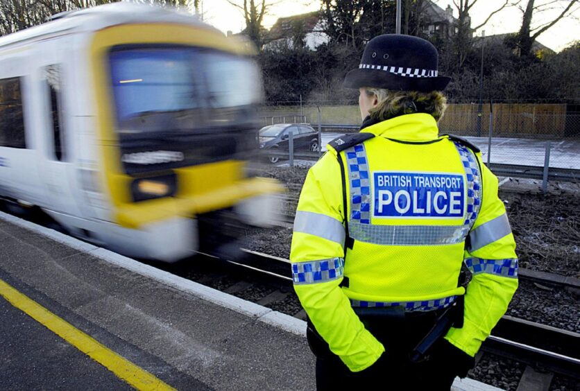 A British Transport Police officer and a train