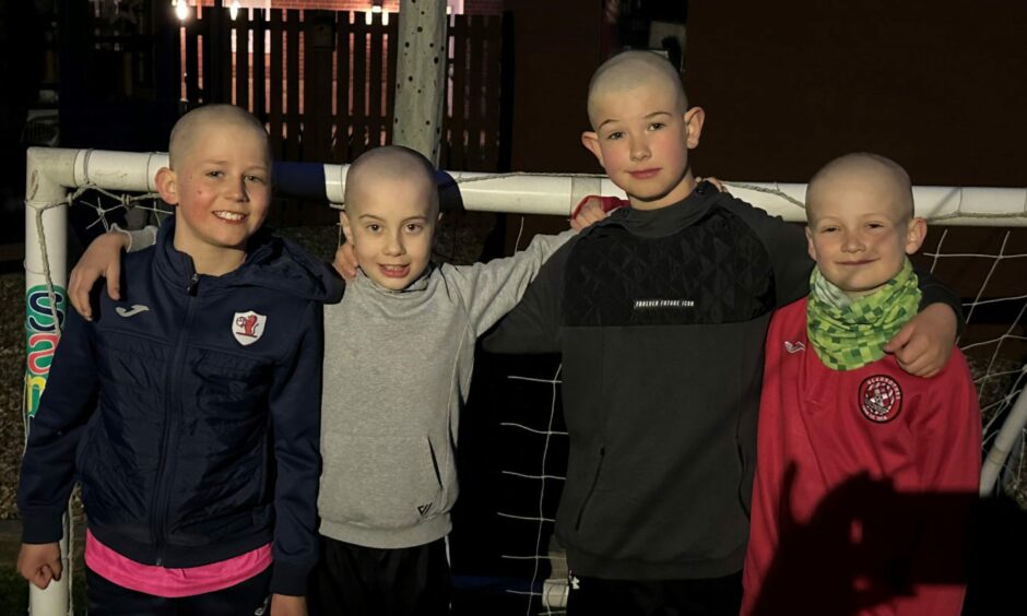 Archie Sinclair from Markinch and three friends with their heads shaved.