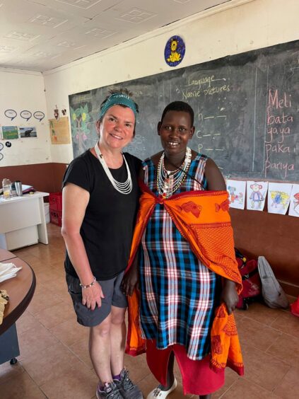 Estelle with a Masaai lady in Kenya who came to pick up a food parcel.
