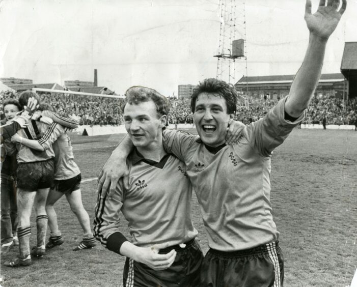 Black and white photo of Dundee United players Ralph Milne and John Reilly in 1983.