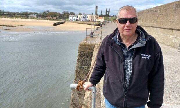 St Andrews Harbourmaster John Lambert at the end of the main pier at St Andrews Harbour. Image: Michael Alexander