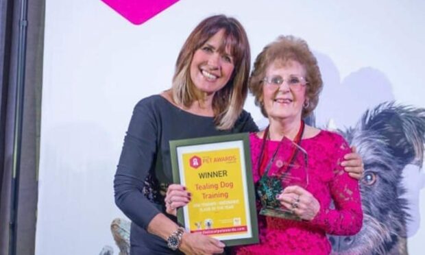 Carol Smillie presents Margaret Thomson with her award