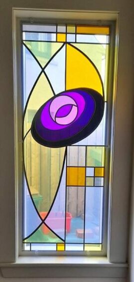 Stained glass window with a contemporary pattern.