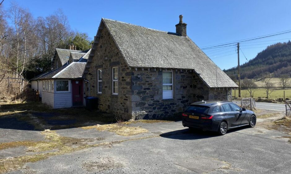 The exterior of the up for auction school. 