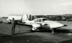 An engineer refuels a Tayside Aviation light aircraft in 1979. Image: DC Thomson.