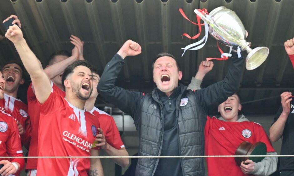 Brechin City manager Andy Kirk and players with the Highland league trophy