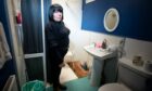 Ashley Cavanagh in the bathroom of her council home. Image: Kim Cessford/DC Thomson