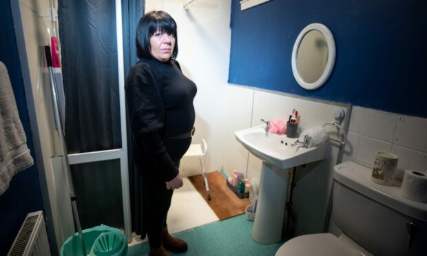Ashley Cavanagh in the bathroom of her council home. Image: Kim Cessford/DC Thomson