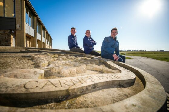Lee Bowan and David Cheape of the community benefits fund with Carnoustie Links chairman Michael Wells.