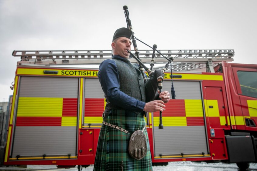 Fire Brigades Union piper, Jack Stewart plays at the event.