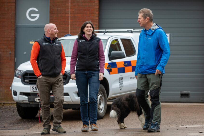 Paul with fellow volunteers Dr Alison Gallagher and Alan Fox with 'Si' the dog at North Tay Complex.