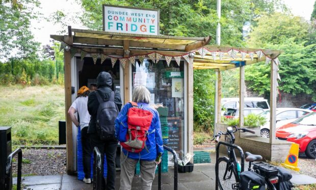 People queuing outside West End Community fridge on Perth Road. Image: Kim Cessford/DC Thomson