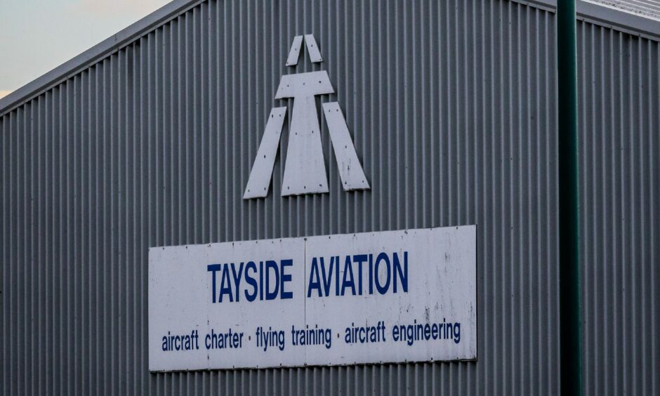 Flight school Tayside Aviation's business sign on office building at Dundee Airport.