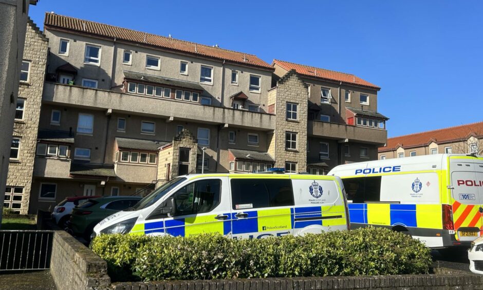 Police descended on the block of flats at around 9am. 
