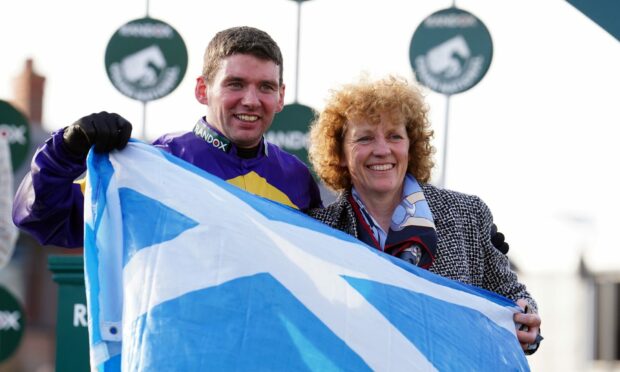 Jockey Derek Fox and trainer Lucinda Russell after winning the Grand National at Aintree. Image: David Davies/PA Wire.