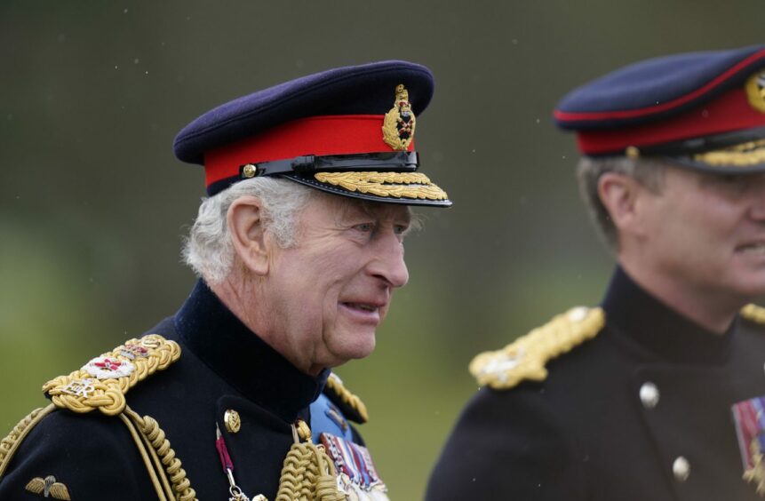 King Charles III in a royal uniform.