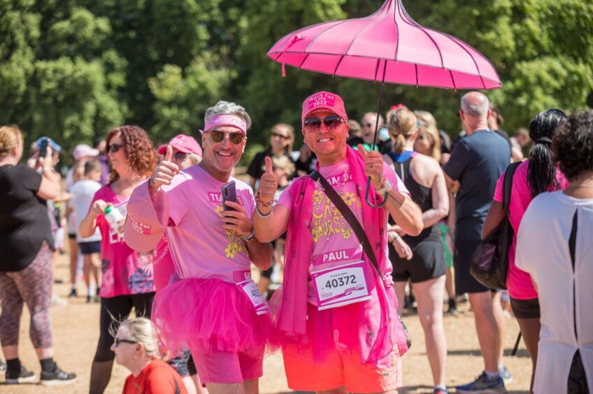 Two Race for Life participants dressed up for the event and celebrating.