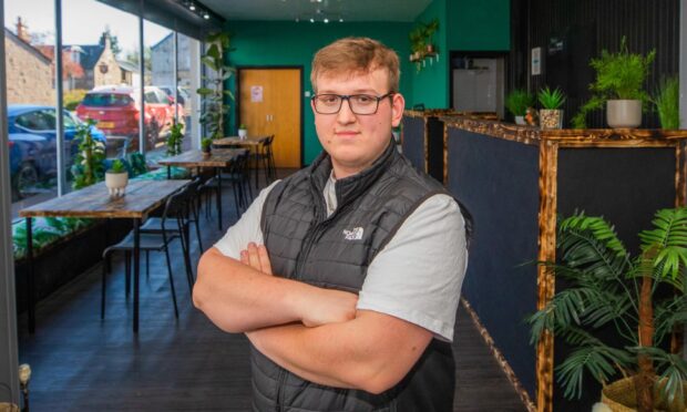 Mateusz Piotr Jazdzewski inside his new café.