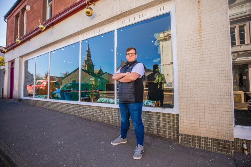 Mateusz outside his new café in Leslie Street, Blairgowrie