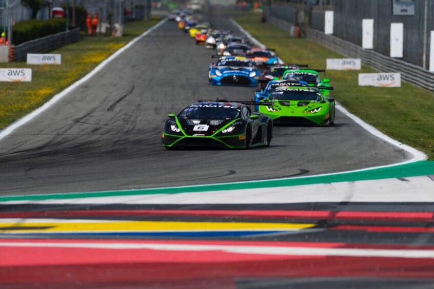 The No. 6 Lamborghini Huracan GT3 Evo2 heads a chasing Monza pack