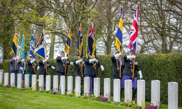 Legion Scotland standard bearers march to the ANZAC graves. Image: Steve Brown/DC Thomson