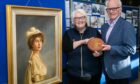 Linda Ballingall and  David Brown from Glenrothes Heritage Centre with the Number 8 plaque from one of the Titanic lifeboats alongside a portrait of The Countess of Rothes. Image: Steve Brown/DC Thomson