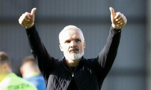 Jim Goodwin gives a thumbs-up to Dundee United fans