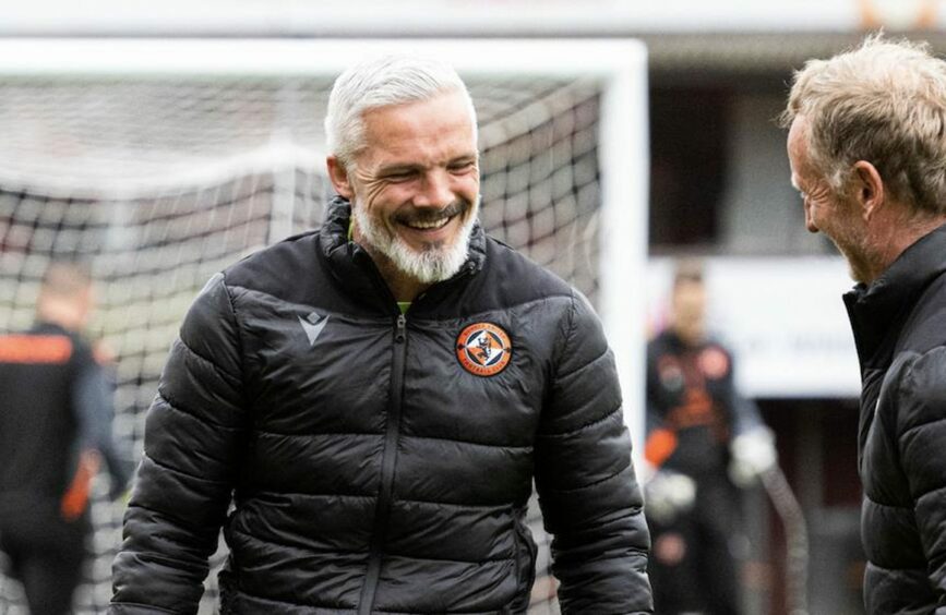 Jim Goodwin shares a joke with United coach and former Tannadice player, Dave Bowman.