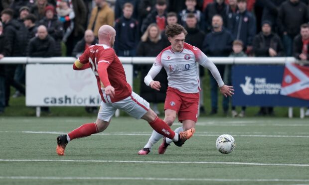 Cammy Russell taking on Brechin City's Euan Spark