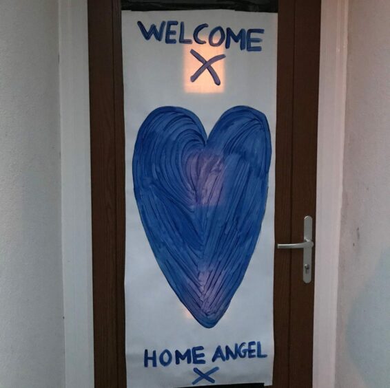 Richard was welcomed home from hospital by appreciative neighbours, who put a sign reading 'welcome home, angel' on his door. Image: Supplied by Richard Stibbles.