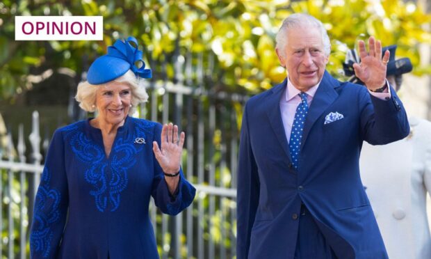 Charles and Camilla wave to photographers