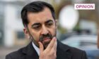 Humza Yousaf scratching his beard and looking pensive.