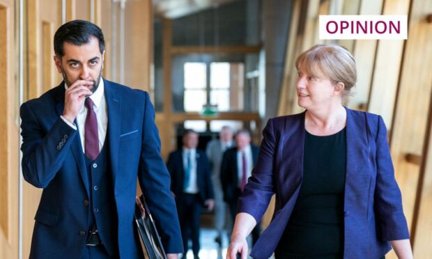 Humza Yousaf and Shona Robison in a corridor at the Scottish parliament