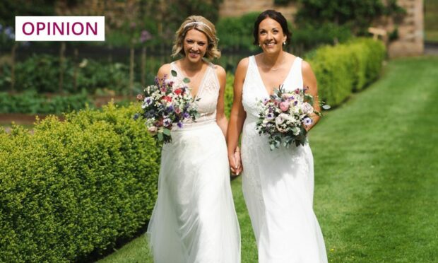 Kezia Dugdale and Jenny Gilruth both in white dresses at their wedding.