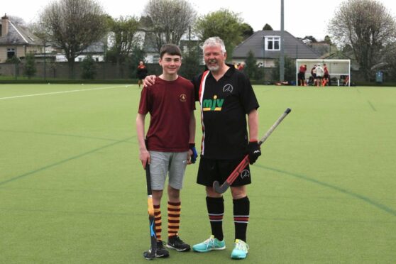 Zander Jones (left) and grandad Ross Gallacher (right) from Dundee were on opposing sides in a weekend Midland League hockey clash in the city. Image: Anne Gallacher