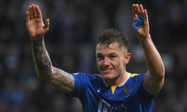 Callum Hendry waves to the fans after helping keep St Johnstone in the Premiership.