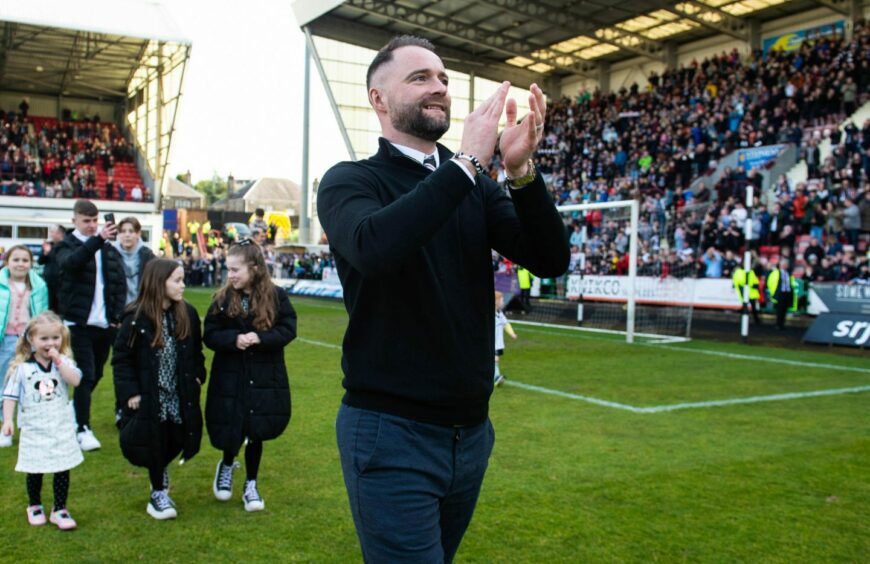 James McPake celebrates with the Dunfermline fans. Image: SNS.