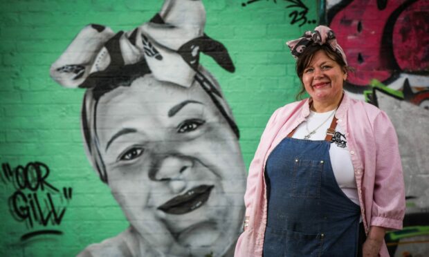 Gill beside the mural of herself. Image: Mhairi Edwards/DC Thomson