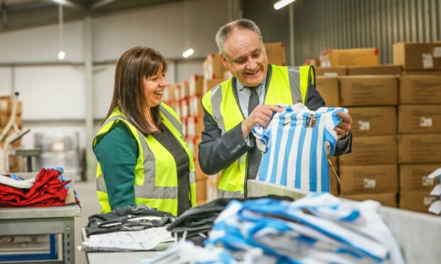 Small Business, Innovation and Trade Minister Richard Lochhead and Joyce Gibson, owner and director of Direct Soccer.