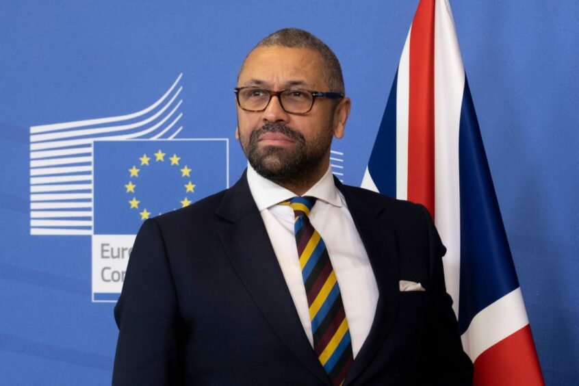 James Cleverly in front of a Union Jack