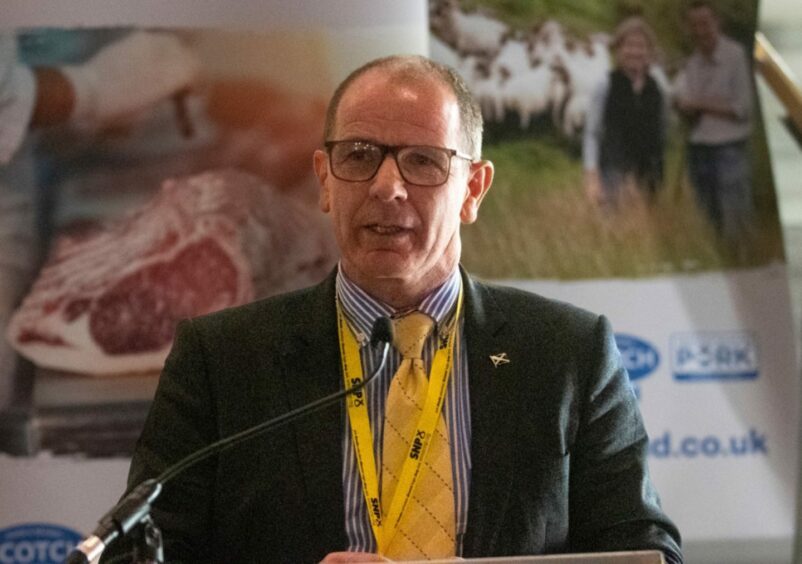 Jim Fairlie on the stage at an agricultural event